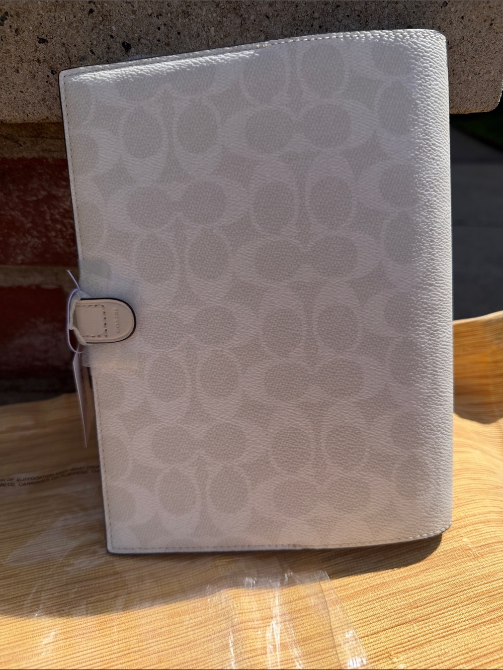Coach Cream Signature Leather Agenda with Snap Strap Chuck and white color